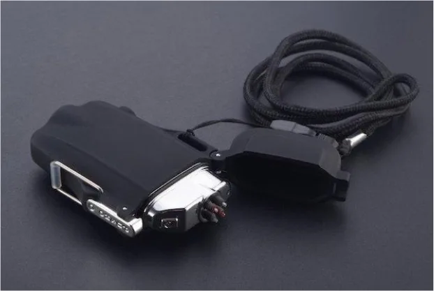 Black Lighter on its side showing the flashlight, battery indicator and black lanyard